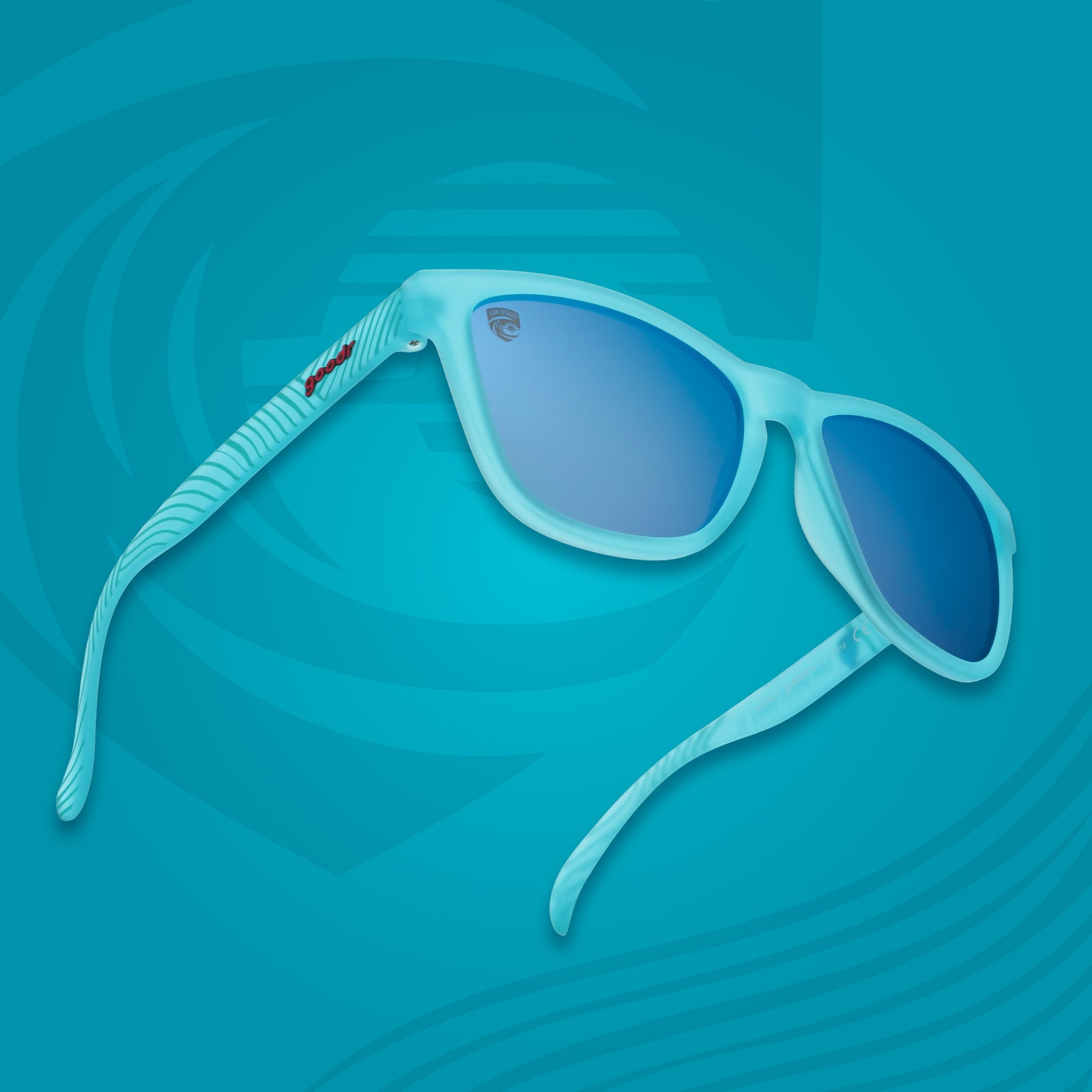 Blue sunglasses with blue reflective lenses on a blue background